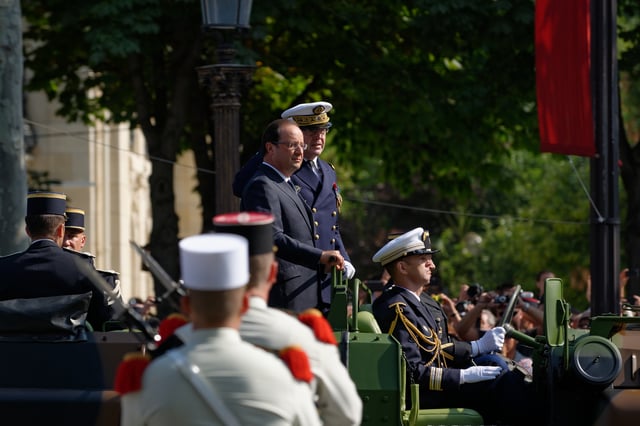 Hollande reviewing troops during the 2013 Bastille Day military parade