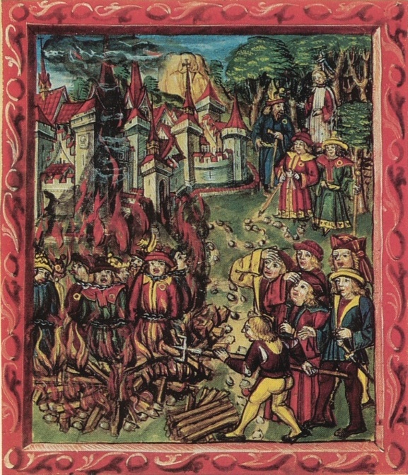 Jews (identified by the mandatory Jewish badge and Jewish hat) being burned.