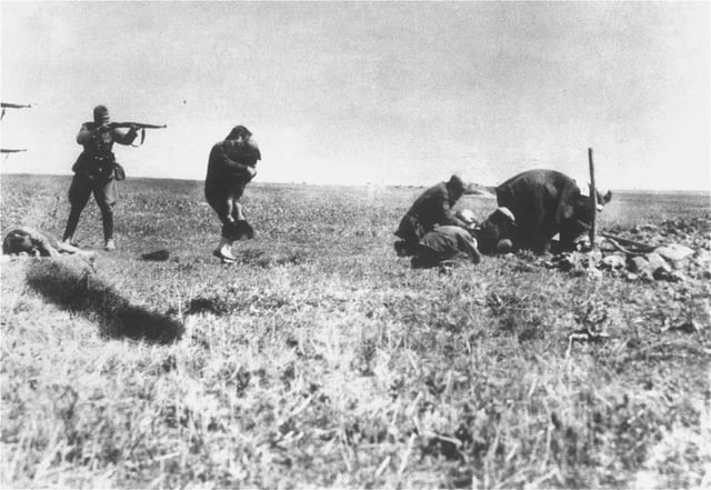 Ivanhorod Einsatzgruppen photograph: Einsatzgruppe shooting a woman and child, near Ivangorod, Ukraine, 1942