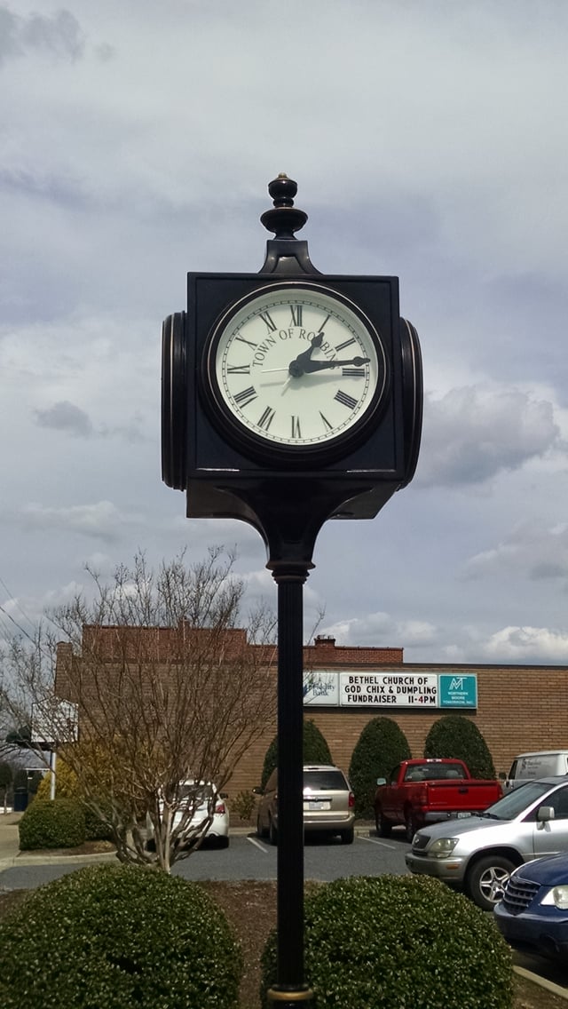 Many cities and towns traditionally have public clocks in a prominent location, such as a town square or city center.  This one is on display at the center of the town of Robbins, North Carolina.