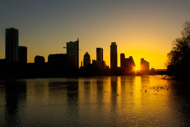 The skyline of Austin, viewed at sunrise from Zilker Park, 2013