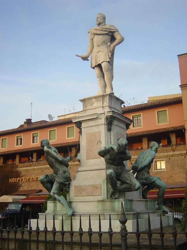Pietro Tacca's Monumento dei Quattro Mori (Monument of the Four Moors) in Leghorn, showing Ferdinando holding baton of a field marshal standing victorious above chained Moorish captives. (1623)