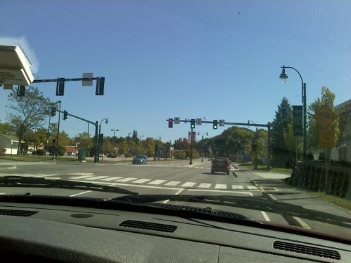 A traffic light in Westbrook, Maine, on State Route 25. Notice the red arrow to the left of the two green straight lights.