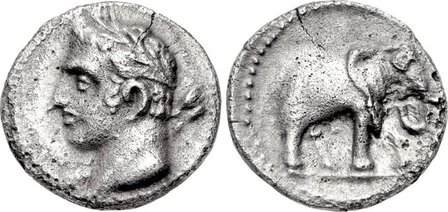 A quarter shekel of Carthage, perhaps minted in Spain. The obverse may depict Hannibal under the traits of young Melqart. The reverse features one of his famous war elephants.