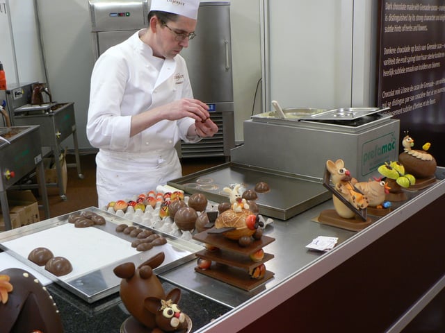 Chocolatier preparing Easter eggs and rabbits