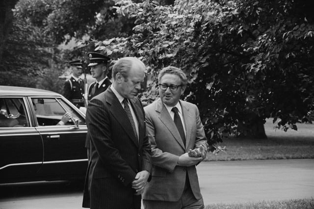 Ford and Kissinger conversing on the White House grounds, August 1974