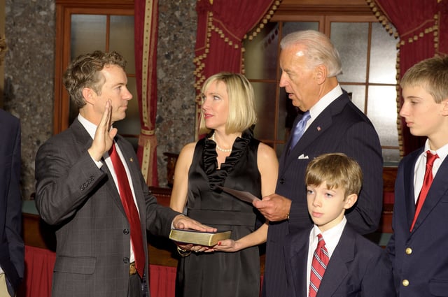 Rand Paul being sworn in as a senator by Vice President Joe Biden, along with his family, in the Old Senate Chamber in the United States Capitol building
