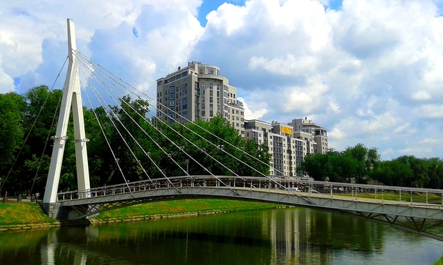 View of modern pedestrian bridge over Kharkiv River in Kharkiv