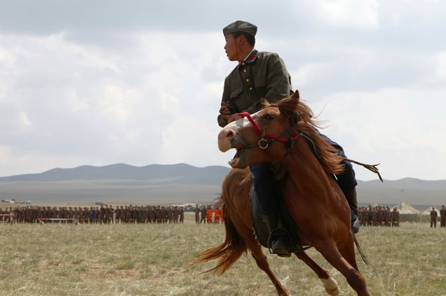 A horseman with Soviet-style uniform performs during the opening ceremony for exercise Khaan Quest 2013 at the Five Hills Training Area in Mongolia Aug. 3, 2013