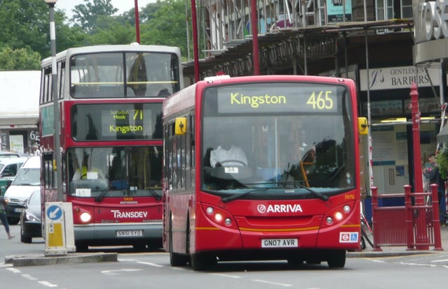 A London double-decker bus and an Abellio Surrey bus in Surbiton.