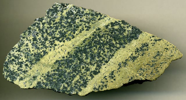 Chromitic serpentinite  (7.9 cm across), Styria Province, Austria. Protolith was  a Proterozoic-Early Paleozoic upper mantle dunite peridotite that has been multiply metamorphosed during the Devonian, Permian, and Mesozoic.