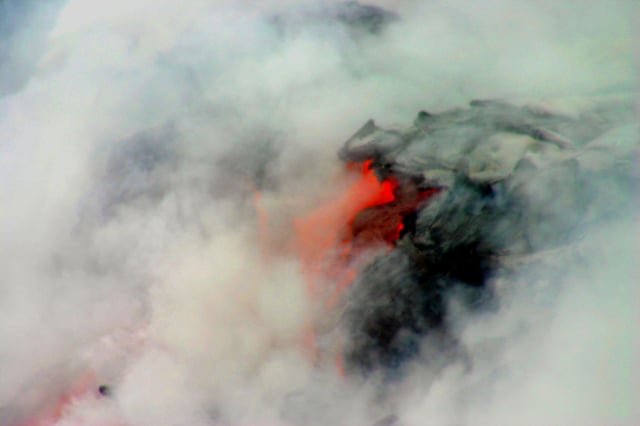 Lava entering the Pacific at Hawaii Volcanoes National Park in April 2005, increasing the size of the island