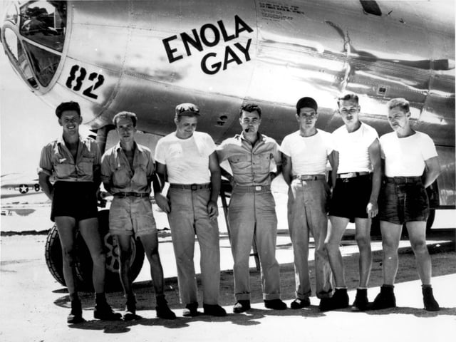 The Enola Gay dropped the "Little Boy" atomic bomb on Hiroshima. Paul Tibbets (center in photograph ) can be seen with six of the aircraft's crew (three on each side).