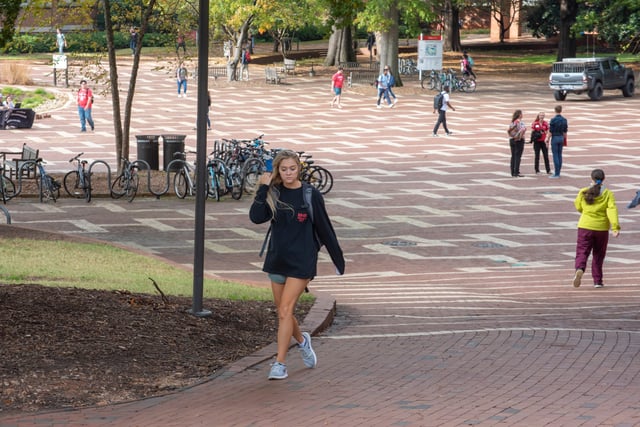 Students walk through the brickyard between classes at North Carolina State University.