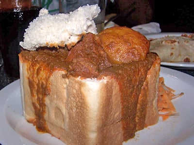 An example of bunny chow served in Durban, originated in the Indian South African community