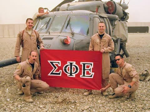 U.S. Army soldiers, presumably members of Sigma Phi Epsilon, display that fraternity's flag in Iraq in 2009.