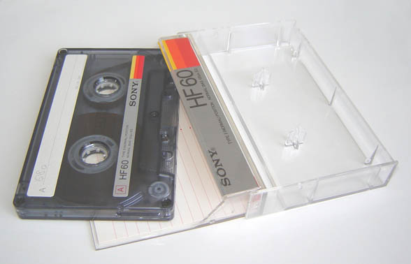 A blank compact cassette tape and case