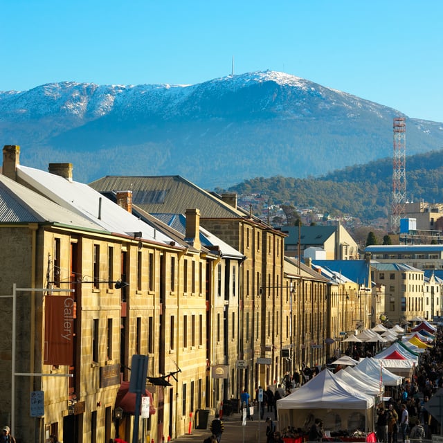 Salamanca Market with the snow-capped Mount Wellington in the background.