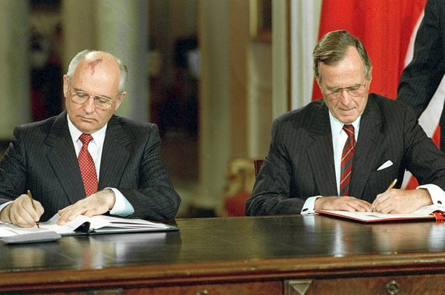 Mikhail Gorbachev and George H. W. Bush signing bilateral documents during Gorbachev's official visit to the United States in 1990
