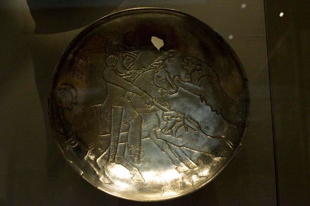 A Sasanian silver plate depicting a royal lion hunt