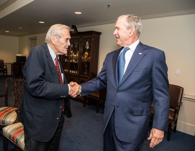 Rumsfeld greeting former President George W. Bush in 2019