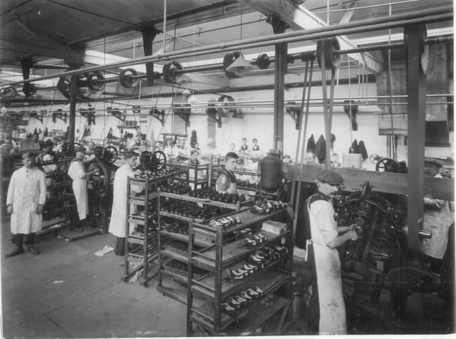 A vintage image of the sewing room in one of the Clarks factories