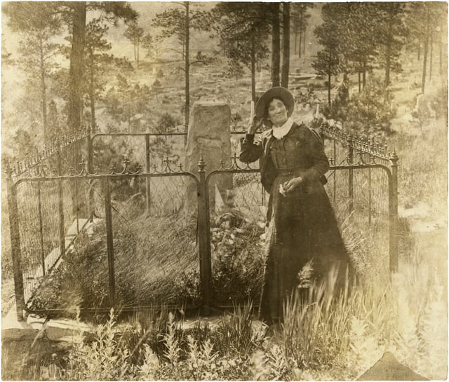 Calamity Jane at Wild Bill Hickok's Gravesite, Deadwood, Dakota Territory.