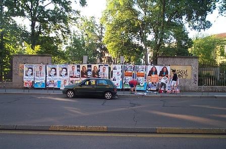 Campaigners working on posters in Milan, Italy, 2004