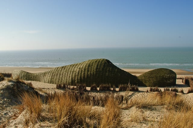 Environmental art installation "Sandworm" in the Wenduine Dunes, Belgium, made entirely out of willow