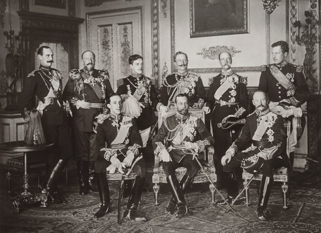 The Nine Sovereigns at Windsor for the funeral of King Edward VII, photographed on 20 May 1910. Standing, from left to right: King Haakon VII of Norway, Tsar Ferdinand of the Bulgarians, King Manuel II of Portugal and the Algarve, Kaiser Wilhelm II of Germany and Prussia, King George I of the Hellenes and King Albert I of the Belgians. Seated, from left to right: King Alfonso XIII of Spain, King George V of the United Kingdom and King Frederick VIII of Denmark.