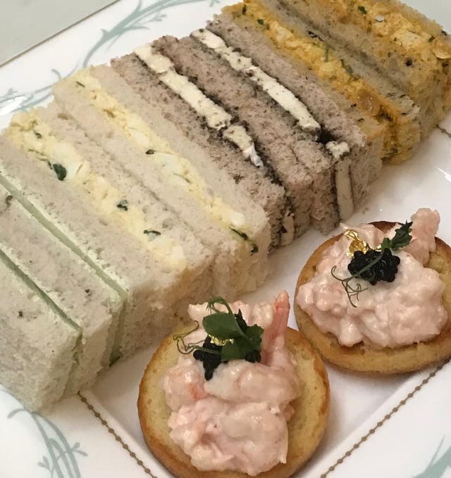 Finger sandwiches: cucumber, egg, cheese, curried chicken, with shrimp canapés at tea.