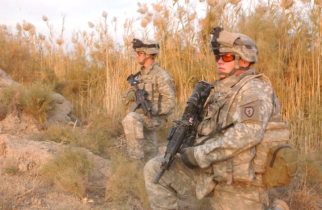 The modern cloth diamonds of the 501st sewn to the Army Combat Uniform helmet cover, as seen in Iraq.  An additional patch is sewn to the opposing side out of view.