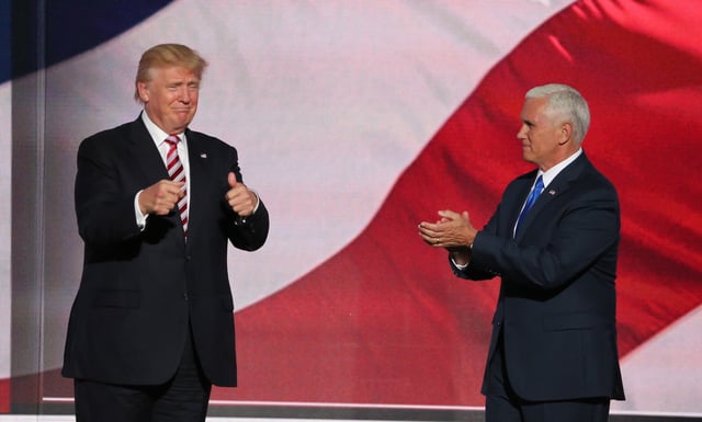 Trump gives the thumbs up as his running mate Mike Pence approves at the Republican National Convention, July 20, 2016