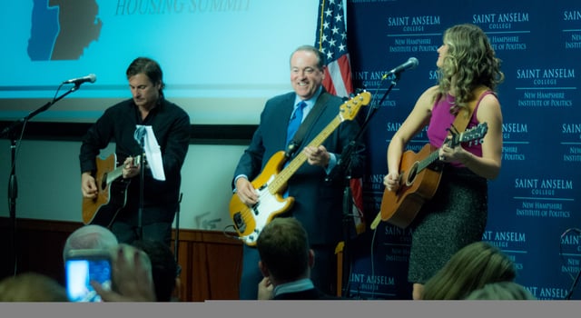 Huckabee plays bass guitar with recording artist Ayla Brown in 2015