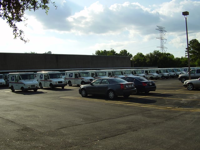 A fleet of post office vehicles at the James Griffith Station in Spring Branch, Houston