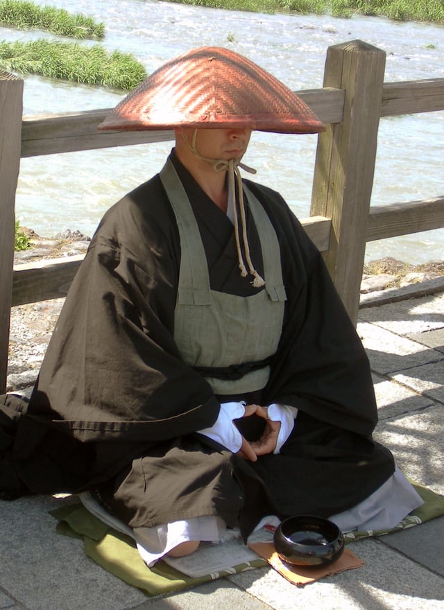 A monk by the Katsura River in Arashiyama