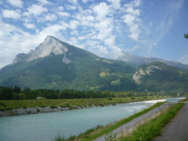 The Rhine: border between Liechtenstein and Switzerland (view towards the Swiss Alps)
