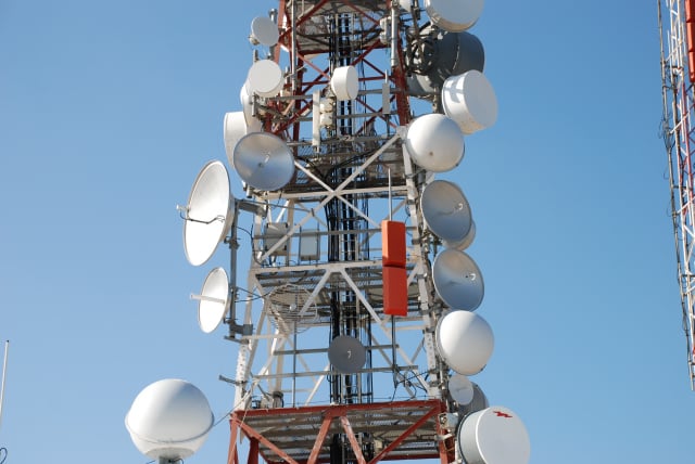 Parabolic antennas of microwave relay links on tower in Australia.