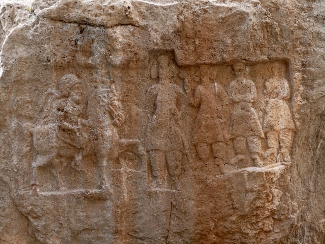 A rock-carved relief of Mithridates I of Parthia (r. c. 171–138 BC), seen riding on horseback, at Kong-e Aždar, city of Izeh, Khūzestān Province, Iran