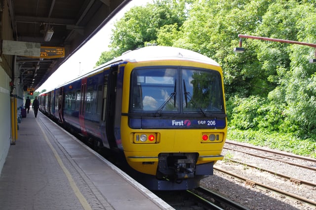 Redhill with a Class 166 service to Reading on the North Downs Line.