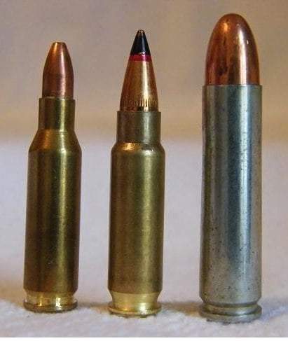 The 5.7×28mm cartridge next to similarly-sized cartridges. From left to right: 4.6×30mm, 5.7×28mm and .30 Carbine.