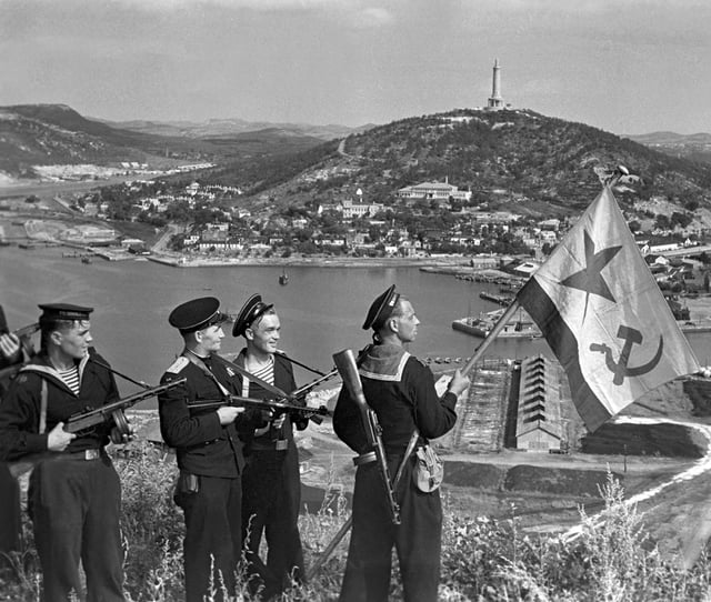 Pacific Fleet marines of the Soviet Navy hoist the Soviet naval ensign in Port Arthur, on 1 October 1945.