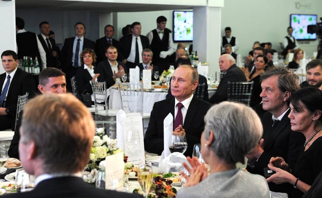In December 2015, Flynn attended RT's 10th anniversary gala. Flynn is sitting next to Vladimir Putin during the dinner. Jill Stein (in the foreground) and Mikhail Gorbachev (in background) also attended the gala.
