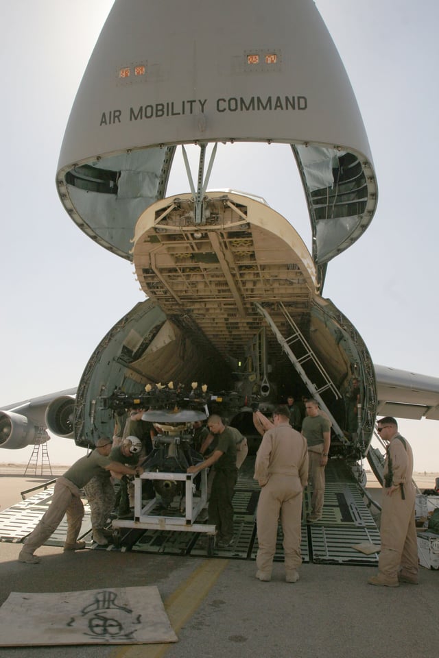 Marines unload CH-46 Sea Knight helicopters from an Air Force C-5 Galaxy