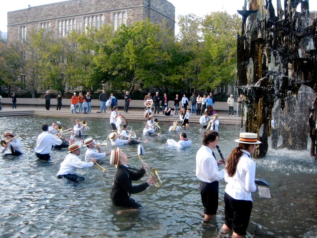 The Princeton University Band lobstering next to James FitzGerald's Fountain of Freedom sculpture at the Woodrow Wilson School