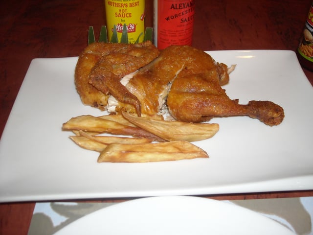 Half a Max fried chicken served with sweet potato fries.