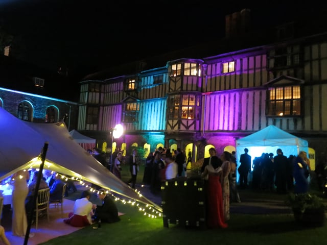 Cloister Court lit up during the 2013 Queens' May Ball