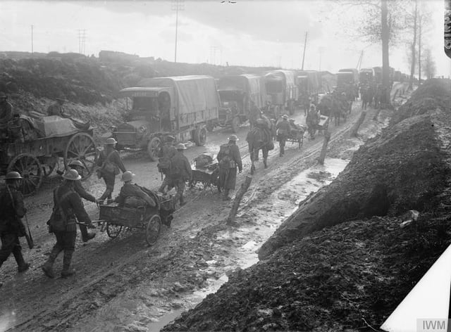 Infantrymen of the Middlesex Regiment with horse-drawn Lewis gun carts returning from the trenches near Albert, France in September 1916. In the background is a line of supply lorries.