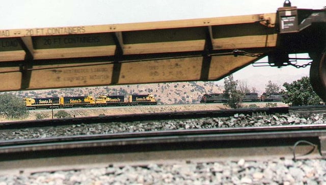 AT&SF and SP Railroad trains meet at Walong siding on the Tehachapi Loop in the late 1980s