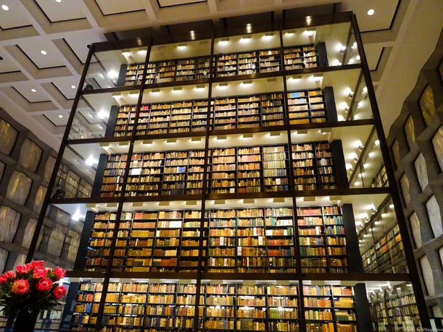A glass tower displays and protects the rare books
